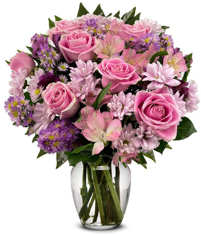 A bouquet featuring pink roses, purple daisies, pink alstroemeria, purple alstroemeria, and purple Monte Casino, with an optional vase.