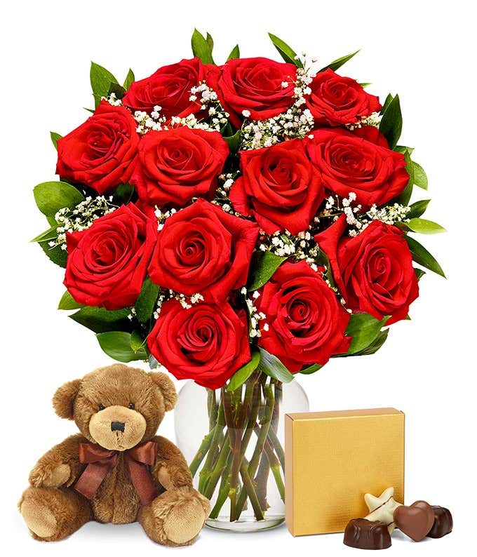 A romantic gift set featuring long stem red roses, a box of chocolates, and a plush teddy bear. This perfect combination offers a heartfelt and memorable display for any special occasion.