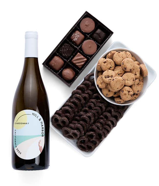 a gift box full of decadent treats.  Contents include: a bottle of California Chardonnay, a bag of milk chocolate pretzel, a box of mini chocolate chip cookies, and a 4-ounce box of assorted chocolates.