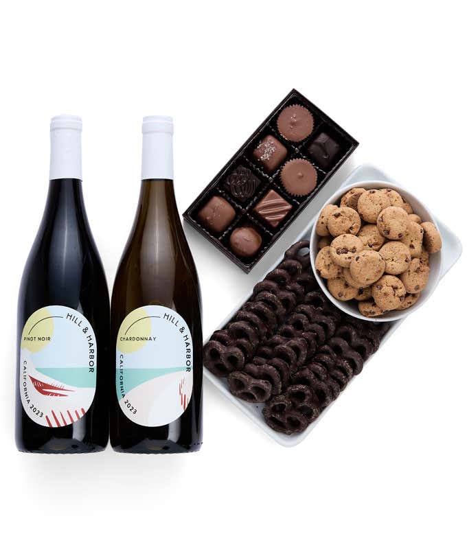 a gift box full of decadent treats.  Contents include: two bottles of California wine -  Chardonnay and Pinot Noir, a bag of milk chocolate pretzel, a box of mini chocolate chip cookies, and a 4-ounce box of assorted chocolates.