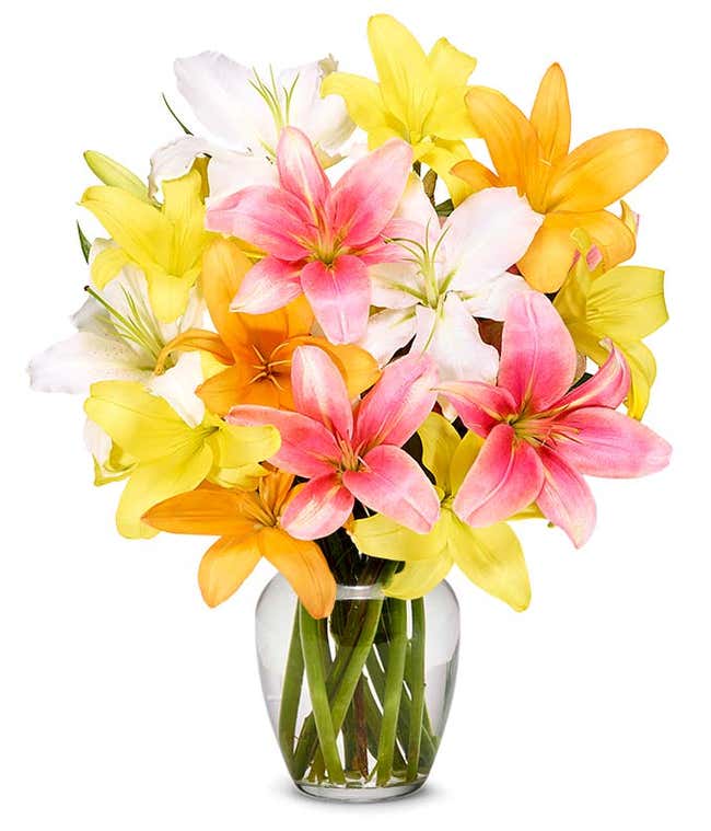 A vibrant floral arrangement featuring pink lilies, orange lilies, and yellow lilies.