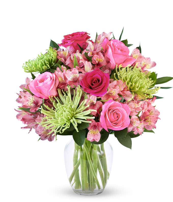 A bouquet featuring pink roses, hot pink roses, green Fuji mums, and pink alstroemeria, with an optional glass vase.